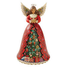 Christmas Spirit Shines Bright Angel
                            plays We Wish You a Merry Christmas