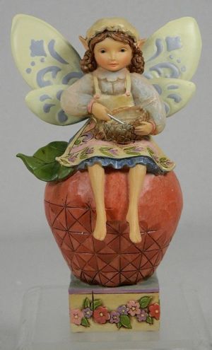 Mixer of Enchantment -
                                    Fairy/Angel with Mixing Bowl on Top
                                    of an Apple