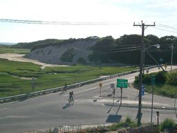 view of road leading to bike path and beach