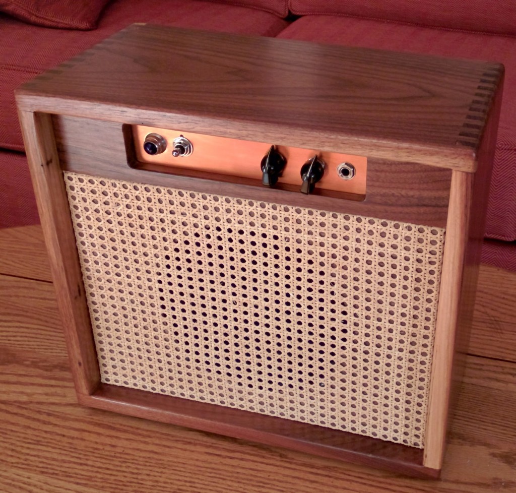 Another front view of the walnut,
              wicker, and copper cabinet