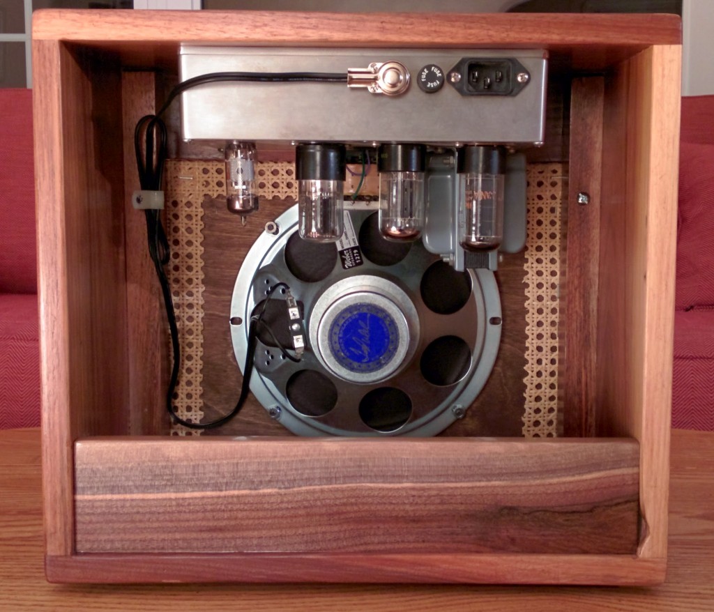 Rear view of amplifier cabinet in
              walnut, wicker, and copper