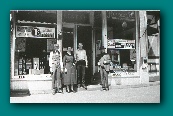 C. F. Kent Pharmacy about 1925, Charles on left