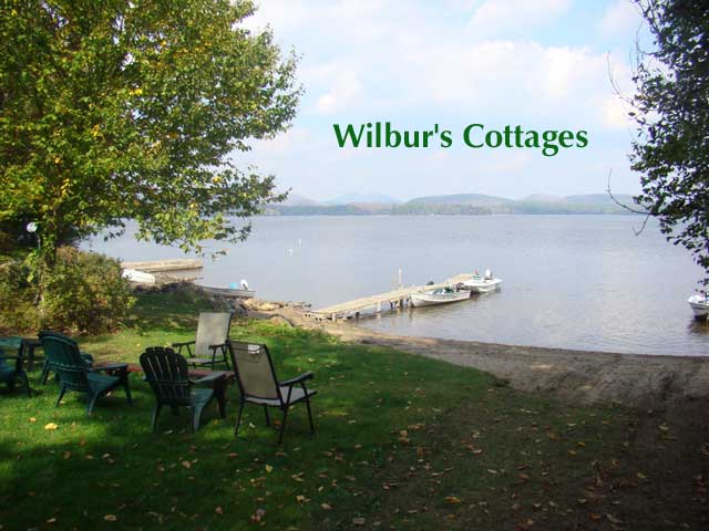 The beach, dock, and view of Sacandaga lake at Wilbur's Cottages