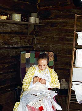 Photo of girl in log cabin