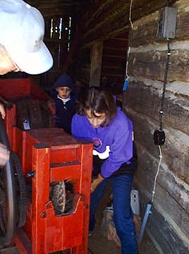 Photo of girls at the corn sheller