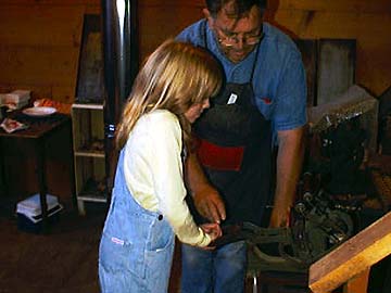 Photo of girl at hand press