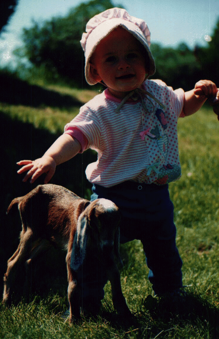 Viveka standing with goat kid.gif (455007 bytes)