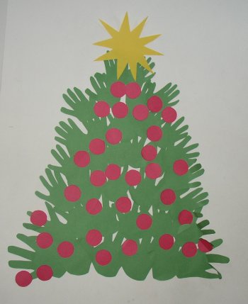 A Christmas tree made from the kids hand on paper